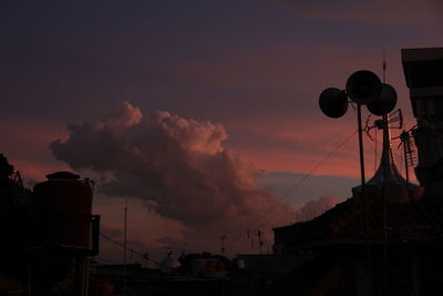 Low angle view of silhouette building against sky during sunset