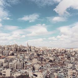 Aerial view of cityscape against sky