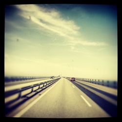 View of road against cloudy sky