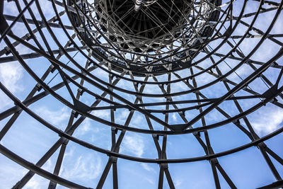 Low angle view of communications tower against sky