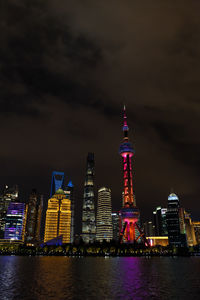 Illuminated buildings in city at night