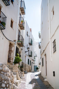 Narrow alley amidst buildings in city