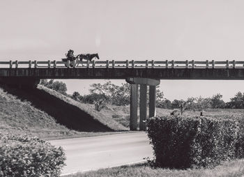 Bridge over river against clear sky