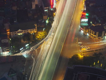 High angle view of light trails on city street at night