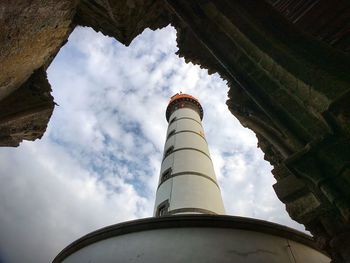 Low angle view of factory against sky