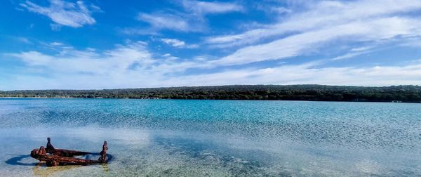 Scenic view of sea against blue sky