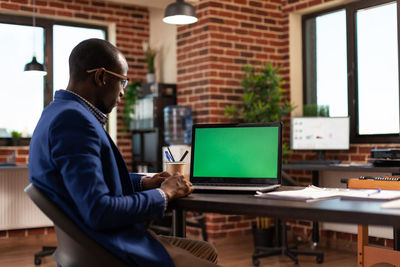 Man using laptop at home