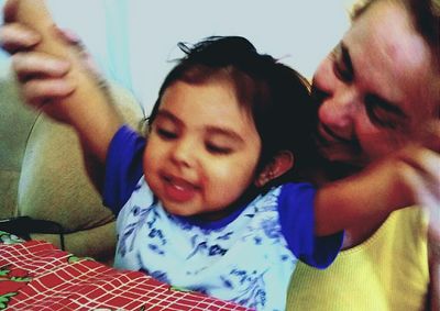 Portrait of mother and daughter at home