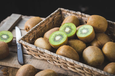 High angle view of fruits in basket on table