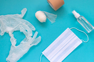 High angle view of plastic on table against blue background