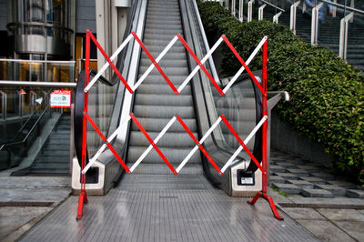 Red shopping cart in city