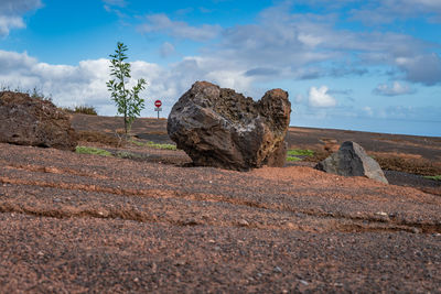 Rock formations on land against sky