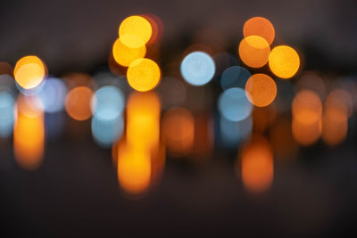 Defocused image of illuminated lights at night