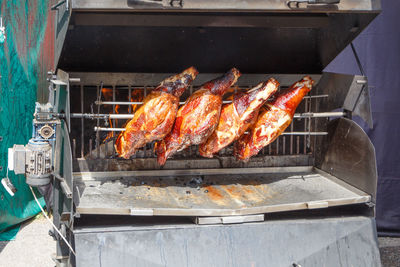 High angle view of meat on barbecue grill