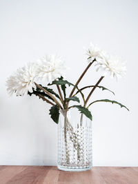 Close-up of white flower vase on table