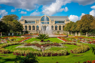 View of historic building in a park. 