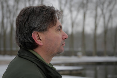 Portrait of young man looking away