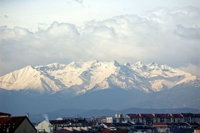 Scenic view of snowcapped mountains against sky