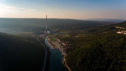 Aerial view of river amidst landscape against sky