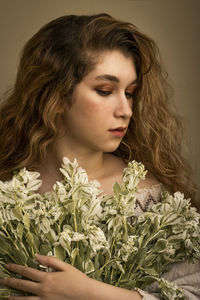 Portrait of young woman looking away