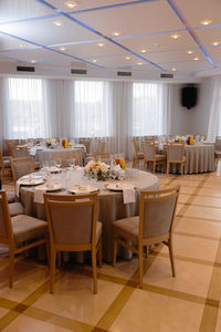 Empty chairs and tables in restaurant