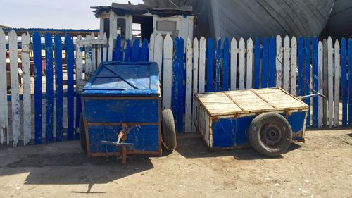 Old carts by fence