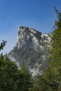 Scenic view of mountains against clear blue sky