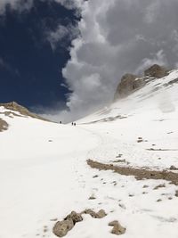 Scenic view of snow covered mountains against sky