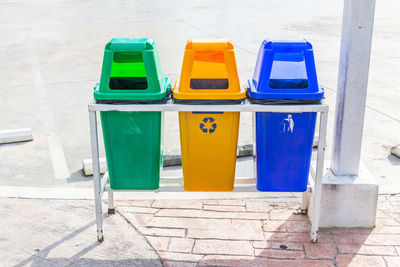 Multi colored chairs in row against blue wall