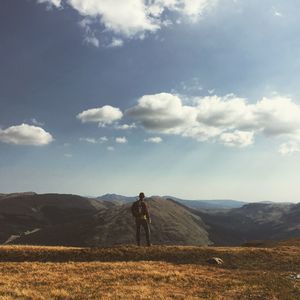 Man on landscape against sky