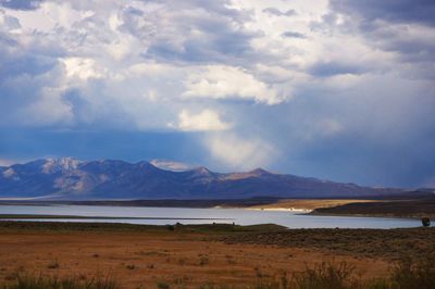 Scenic view of landscape and mountains against sky