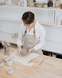 High angle view of man working at table