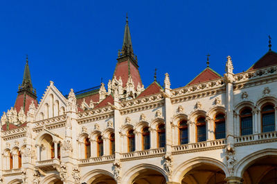 Low angle view of building against blue sky