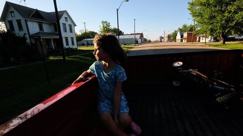 Full length of girl standing on railroad track