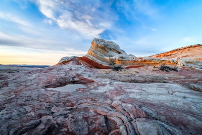 Rock formations on landscape against sky