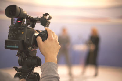 Close-up of man photographing