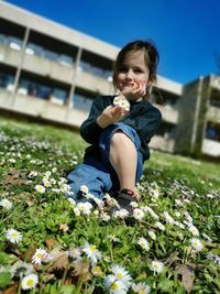Portrait of boy with pink flowers