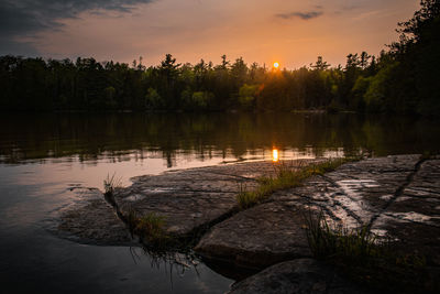 Scenic view of lake against sky during sunset