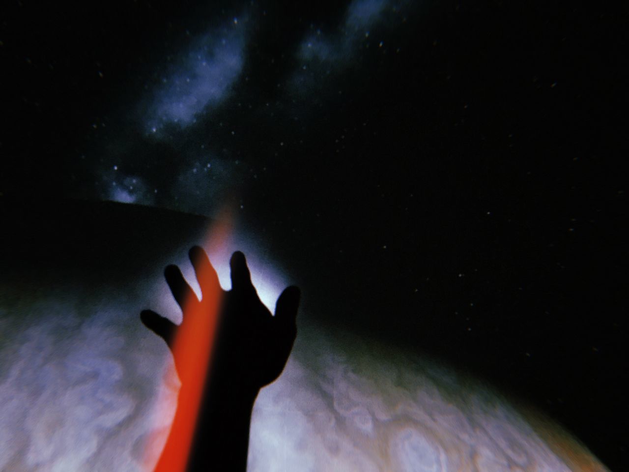 real people, human hand, one person, human body part, hand, unrecognizable person, night, lifestyles, star - space, personal perspective, leisure activity, body part, indoors, silhouette, nature, space, human finger, finger, illuminated, dark, nightlife
