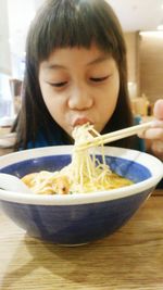 Close-up of a woman eating food