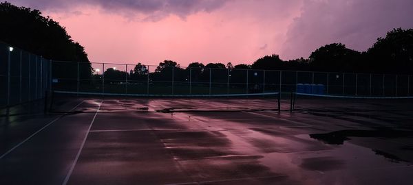 View of swimming pool at sunset