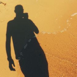 Shadow of people on sand