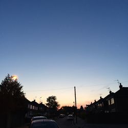Cars on road at sunset