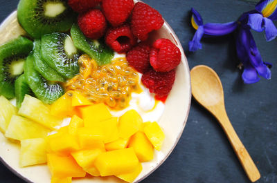 High angle view of chopped fruits in bowl on table