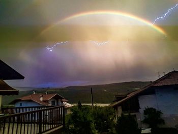 Scenic view of rainbow against sky at night