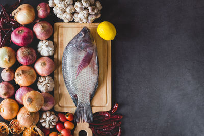 High angle view of food with cutting board on table