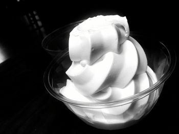 Close-up of white rose over black background