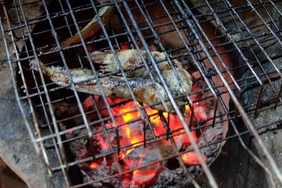 Close-up of meat on barbecue grill