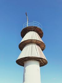 Low angle view of tower against clear blue sky