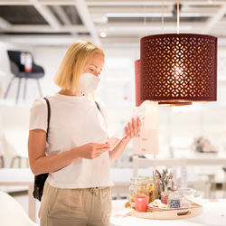 Midsection of woman standing on table